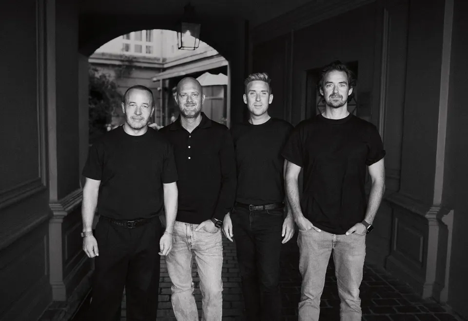 Founding team at office entrance